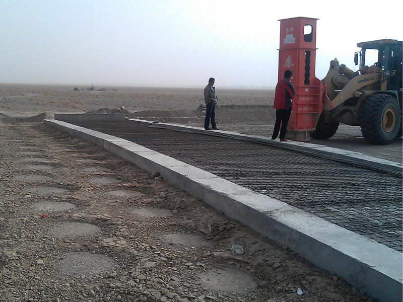 Hydraulic Rapid Impact Compactor construction at abutment back