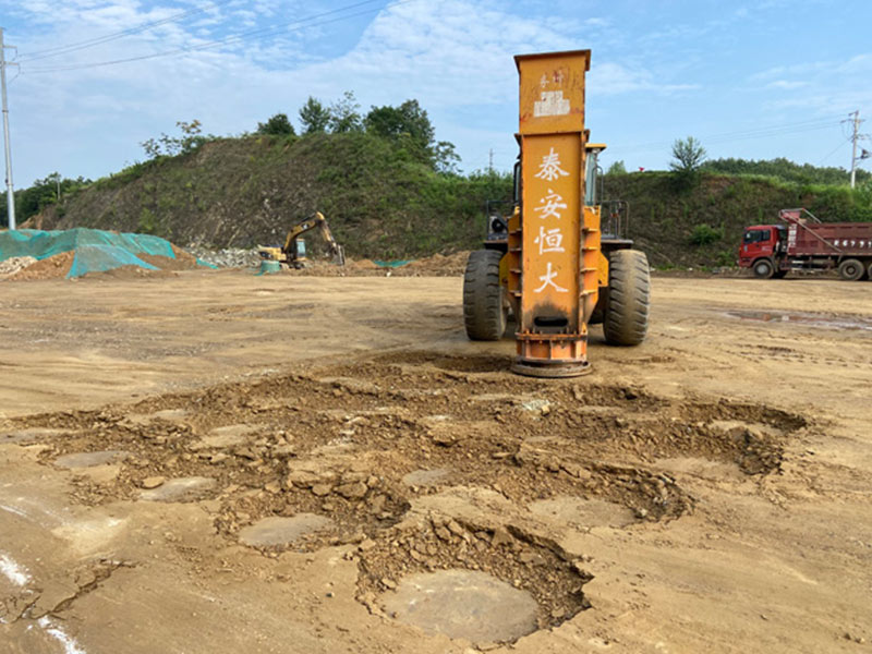 Hydraulic Rapid Impact Compactor is installed on the loader for construction