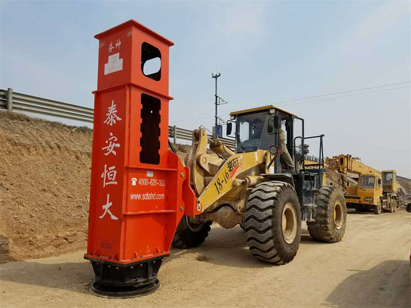 The rapid impact compactor is installed on the loader and displayed